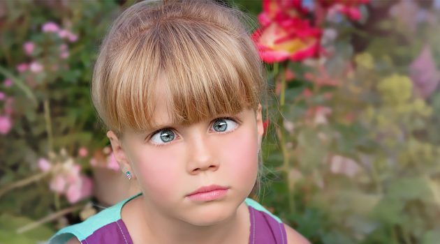 Young girl with her squint or cross-eyed
